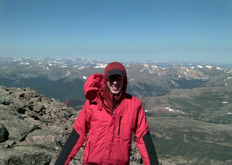 A lowlander friend summits his first 14er, with some amazing views of the Front Range behind him.