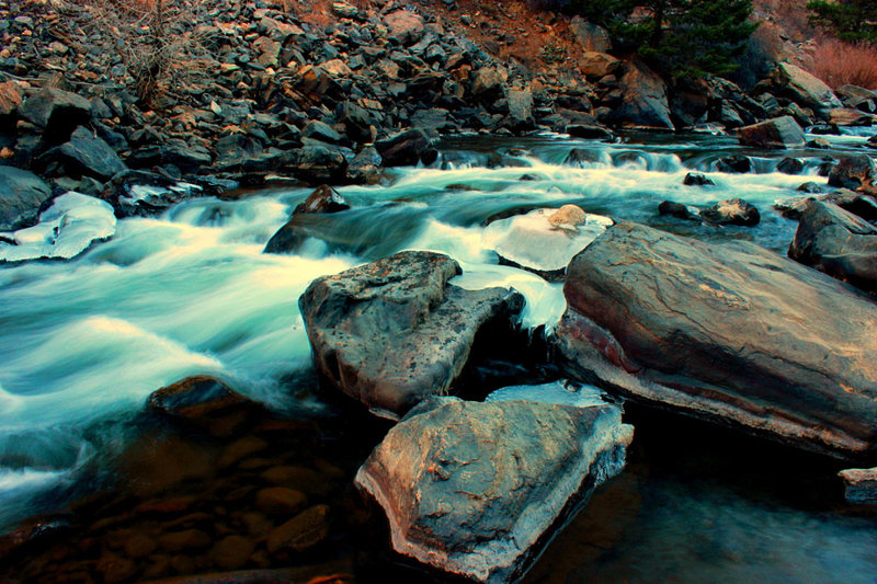 A pleasant creek with interestingly colored rocks.