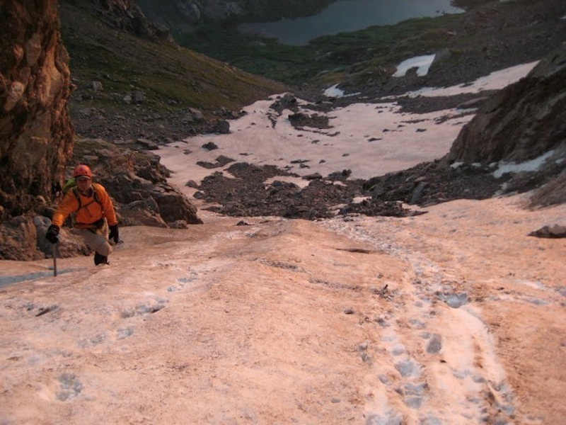 Climbing up some snow on Broken Hand Pass, July 2011.