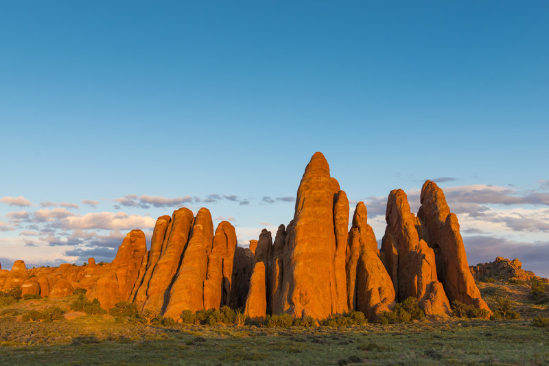 Sunset lights up the fins near Sand Dune Arch.