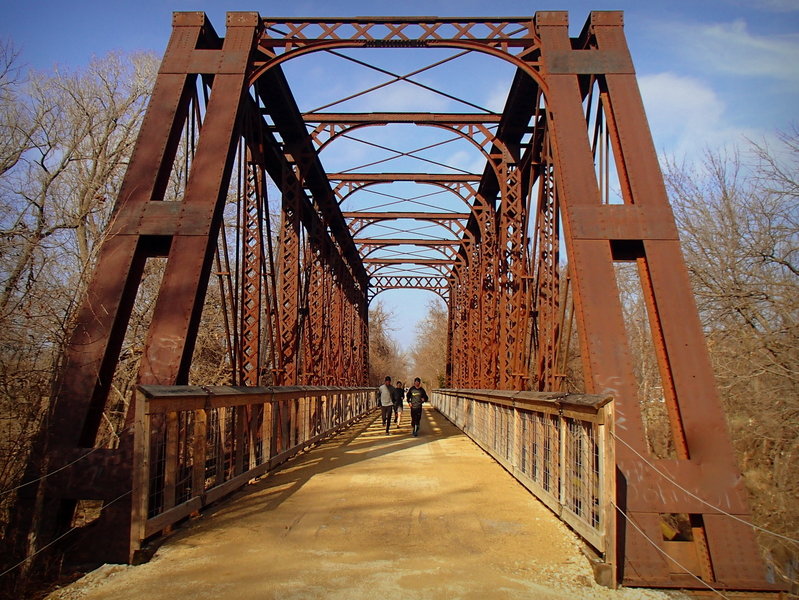 Runners cross the Elm Creek Bridge on the Southwind Rail Trail near Iola, Kansas.