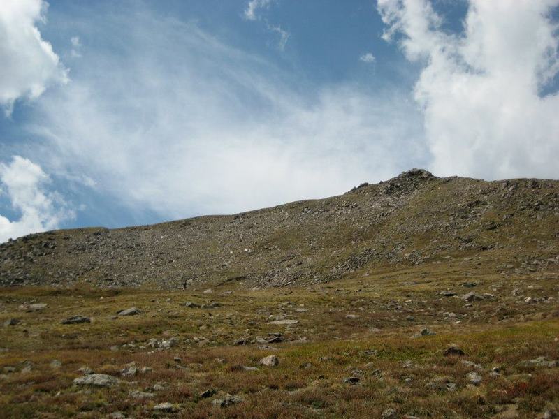 Coming off the traverse, from rocks back to grass on Frenchman Creek Trail