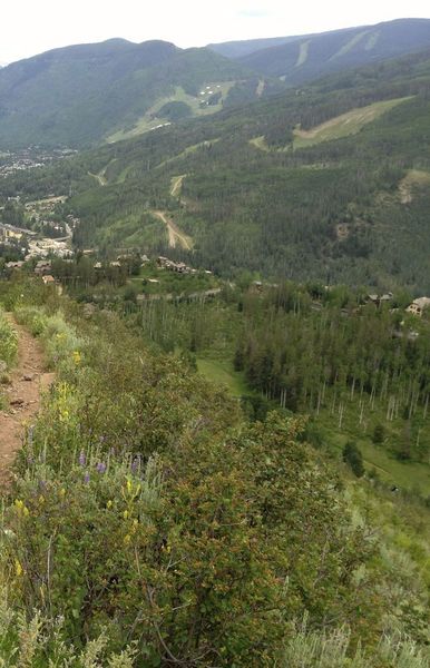 Starting the descent, with views of Vail and the Gore Range.