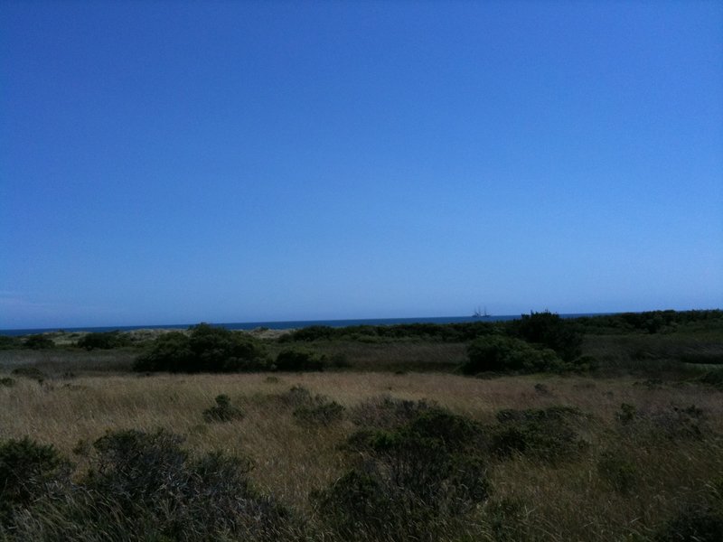 Pirate ship (!) in the distance from the Coast Trail - North