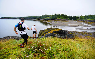 Some 20 k runners going down into the MacNichols cove on their first loop. This photo was in the January 2013 Trail Runner Magazine. You can just see a red speck which is a fella on the other side of the cove. Racers scramble up the steep cliff to his right.