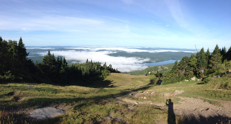 This overlook from Mt. Tremblant summit shows Lake Tremblant partially under cover of morning fog.  This was August, with temperatures in the 40's at the base, and 60's at the peak.