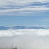 Low clouds fill the valley between Jemez and the Sangre de Christo Mountains.  You can see Santa Fe Baldy and Lake Peak side-by-side.