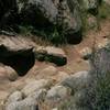 Technical area featuring large rocks and loose dirt.