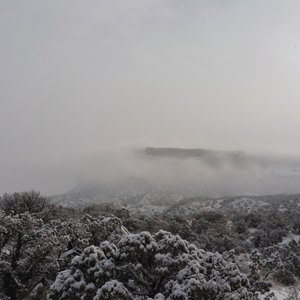 The clouds like fog across the plateau.  On the Monument Valley Trail