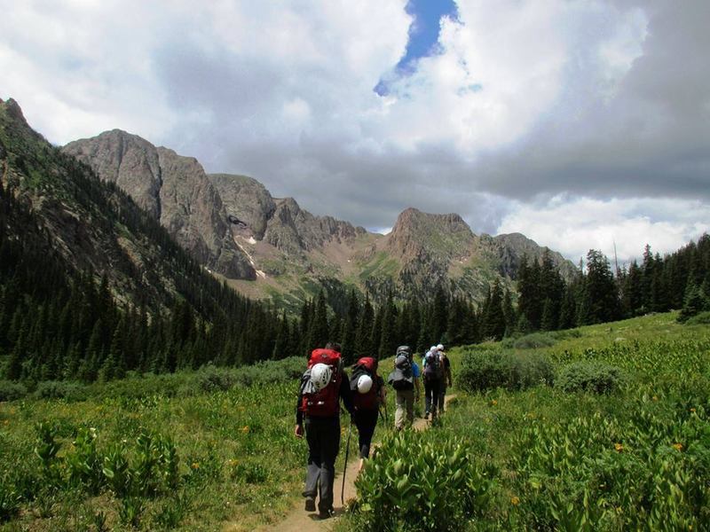 Hikers stroll into camp with Chicago Basin's Needle Mountains in the background. You wanna go here now, don't you?  Chicago Basin Trail