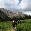 Hikers stroll into camp with Chicago Basin's Needle Mountains in the background. You wanna go here now, don't you?  Chicago Basin Trail