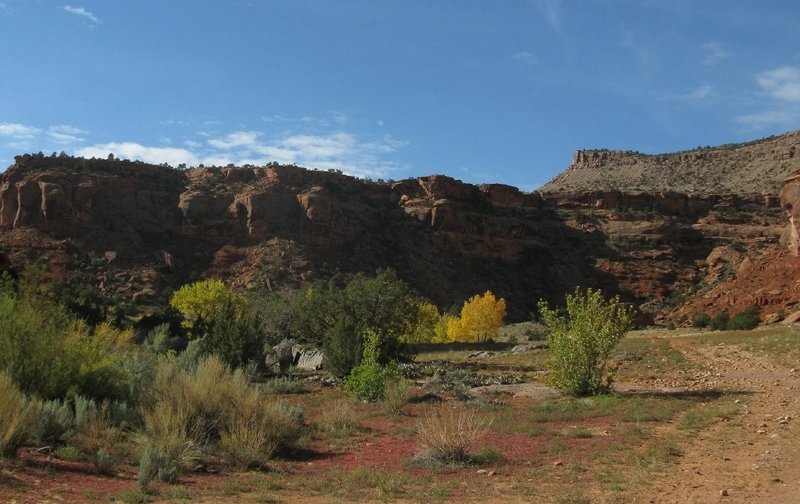 Following the old road between the red sandstone cliffs