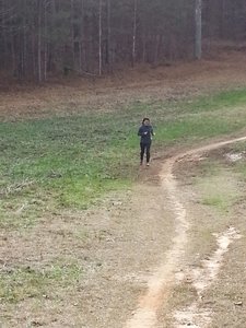My wife (ha ha ha Borat), running through the clearing.