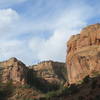 Red sandstone cliff walls line Ladder Canyon