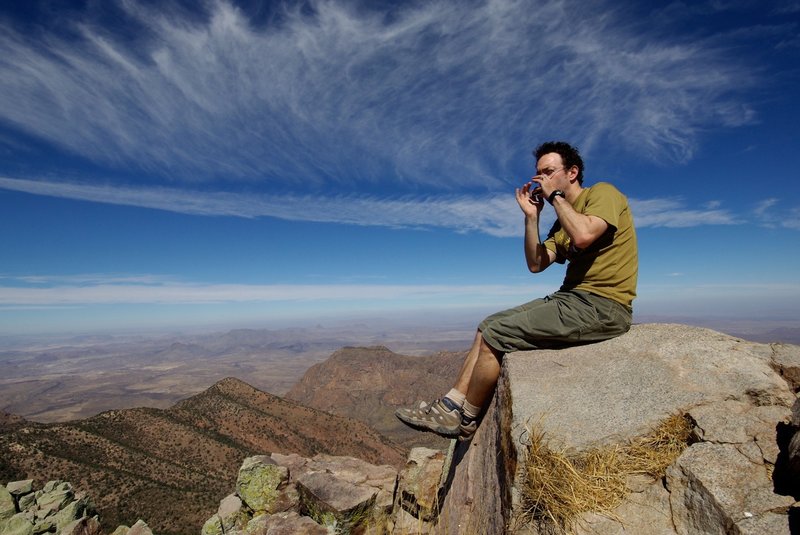 Playing the harmonica on Emory Peak