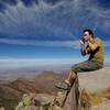 Playing the harmonica on Emory Peak