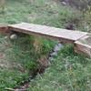 A bridge over a small brook. The vegetation near this water source is beautiful.