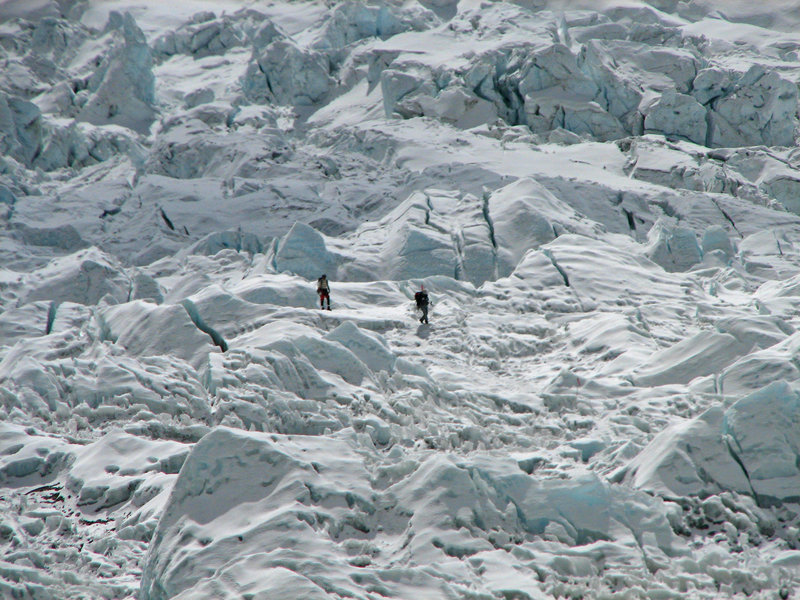 Climbers descending through icefall