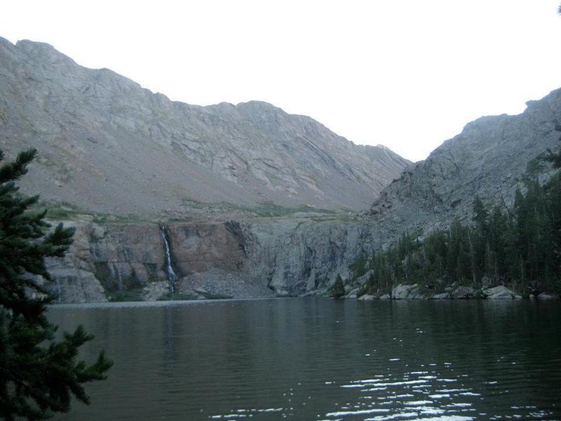 Willow Lake, its cliffs, and waterfall. Kit Carson and Challenger are up to the right, obscured from view.