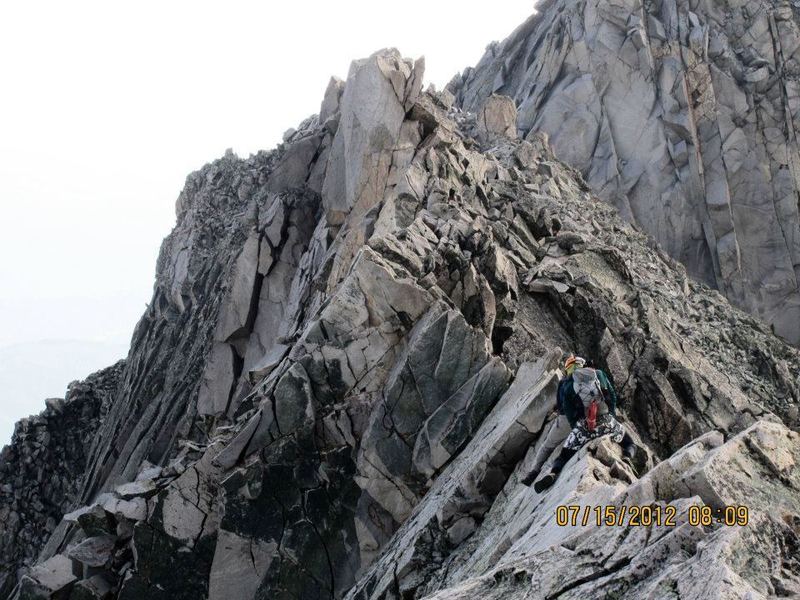 Coming back across the knife edge after a successful summit.