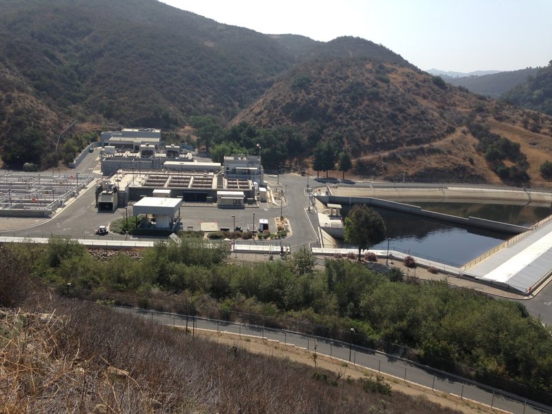 The water treatment plant along the back side of the park.