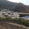 The water treatment plant along the back side of the park.