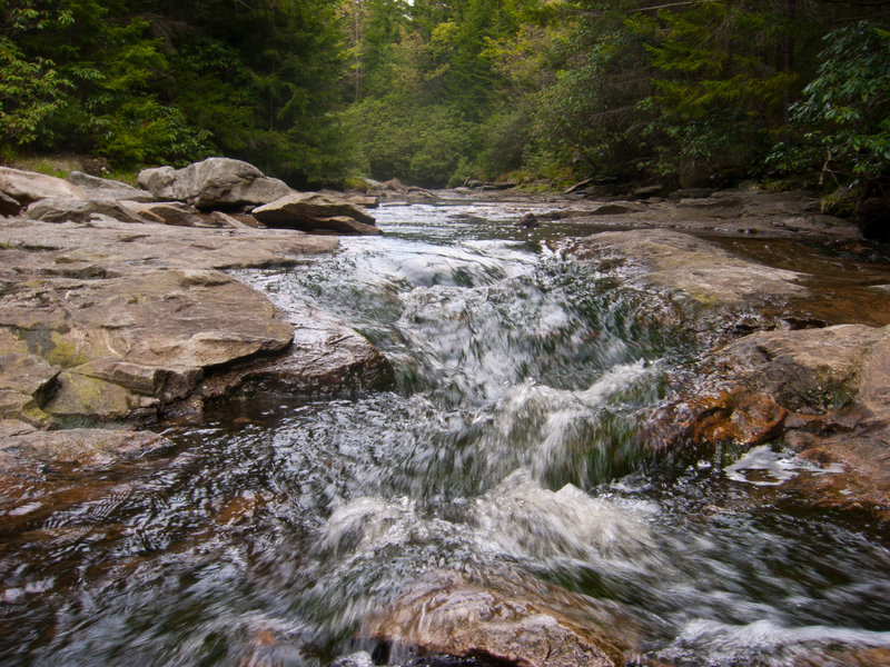 Cascades of water coming down the creek