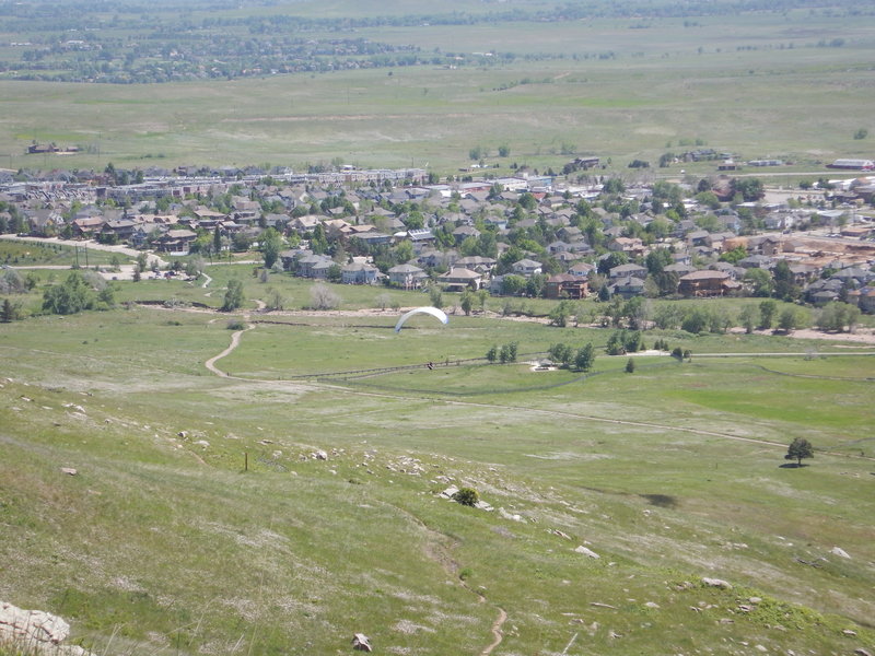 Paraglider preparing to land down below