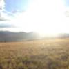 Sunlight spilling through the clouds slowly filling the Valles Caldera.