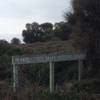 Sign at the corner where the trail heads up hill.