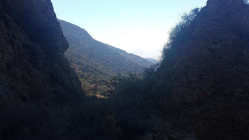 Area where the trail splits two large rock formations.