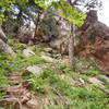 Scramble up through the notch to reach the climbing on the backside