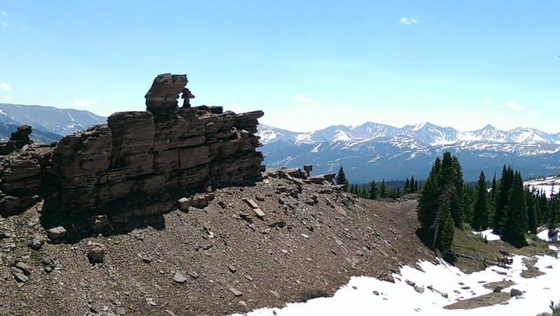 Red sandstone fin projects from the side of this mountian