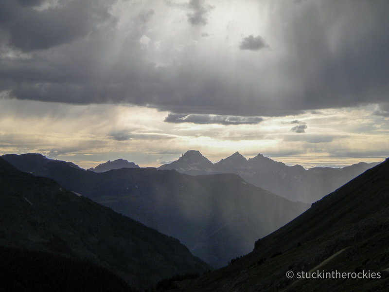 View to the west form near the top of Engineer Pass. Potosi Peak, Mt. Sneffels, and Teakettle Mountain are in silouhette.