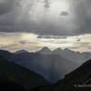 View to the west form near the top of Engineer Pass. Potosi Peak, Mt. Sneffels, and Teakettle Mountain are in silouhette.