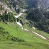 A view of a gully with some snowfields, even in late June