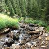 The view down from the crossing at Alpine Brook at mile 2