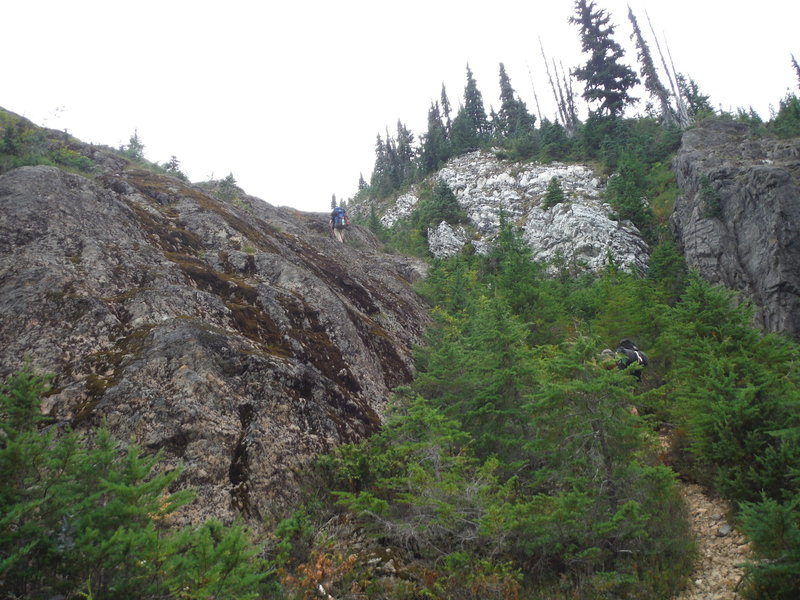 A look upward to the remaining bluffy portion of the trail. Although it looks exposed, the route has good friction on the rock.