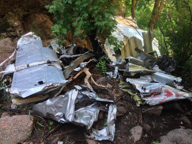 More of the TWA wreckage. The large section on the left appears to be part of the vertical stabilizer (the smaller "wings" that are part of the tail).