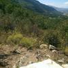 This tiny rock bench just off the trail offers a pleasant view.