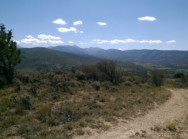 The impressive high peaks loom in the distance.