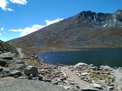 Summit Lake glitters in the sunshine below the summit of Mount Evans.
