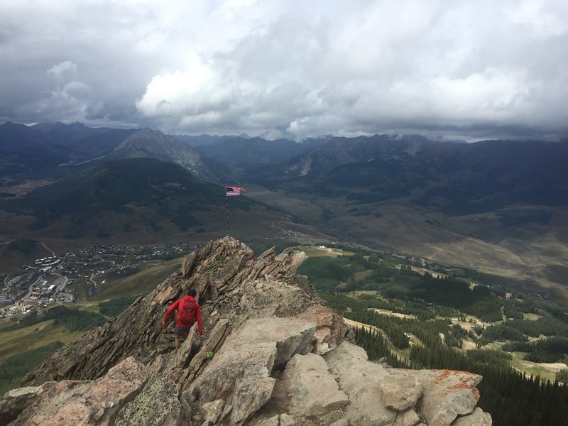 Scrambling to the American flag just off of the Mt. Crested Butte summit.