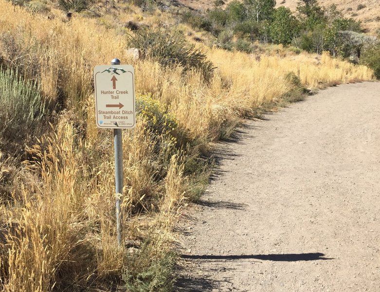 This sign marks where to access the Steamboat Ditch Trail near the Hunter Creek trailhead.