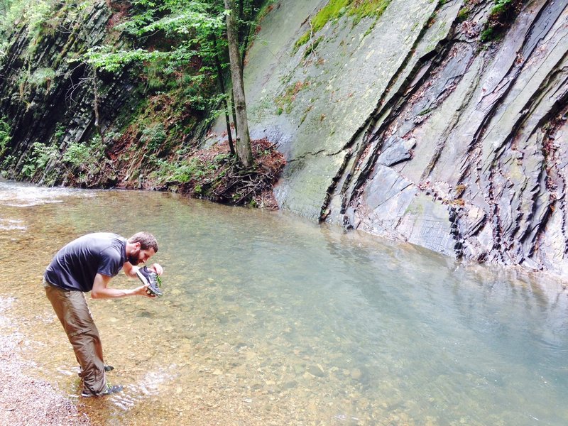 Stopping at a small creek along the trail to clean debris out of my shoes.