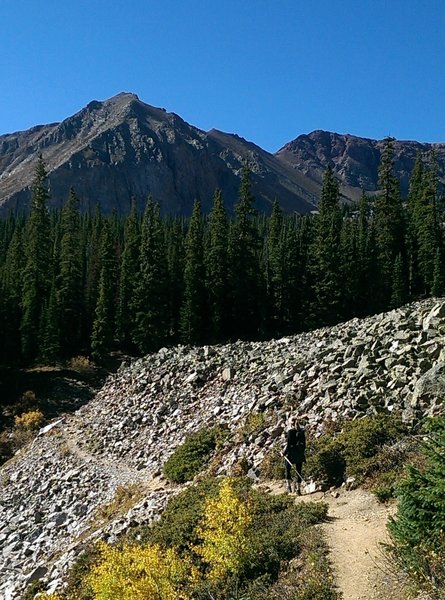 Cross through a patch of scree on the way to the lake