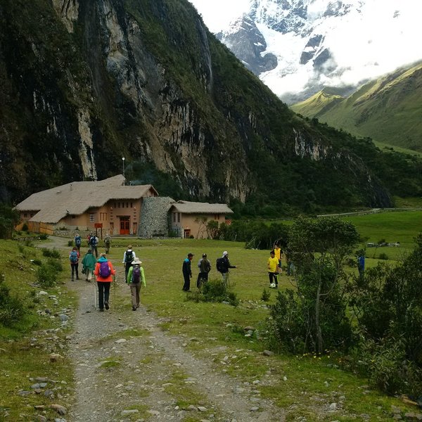 Approaching the Salkantay Lodge with the mountains of the Andes in the background.