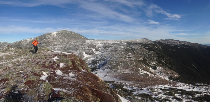 Taking on the Presidential Traverse, with Mt. Washington in the background.