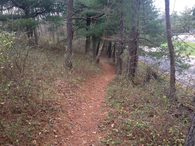 The parking lot is visible on the right as the Prospect Hill Loop trail circles the school grounds.