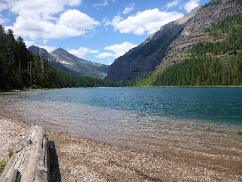 If you continue on the Avalanche Lake Trail past the first beach to the far end of the lake, swimming holes and a quieter shoreline await.